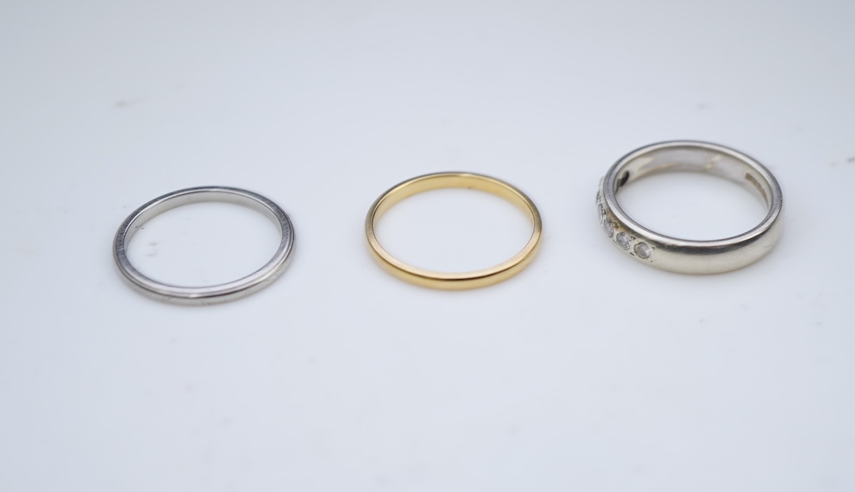 A diamond ring and two gold wedding rings